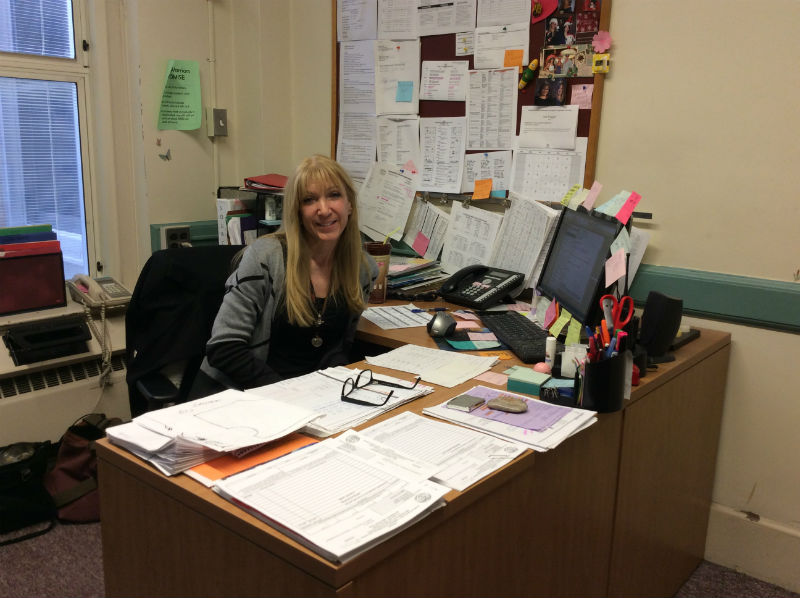 SUPPORT PERSON OF THE YEAR: Ms. Palkovics shines a smile at her office on a busy work day