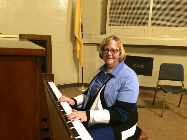 A TALENTED MUSICIAN : Ms. VanKleef smiles as she plays the piano. 