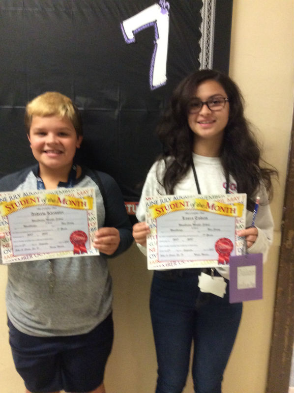SEPTEMBER STUDENTS OF THE MONTH: Laura Tobias and Andrew Kleissler happily accept the first seventh grade student of the month award.