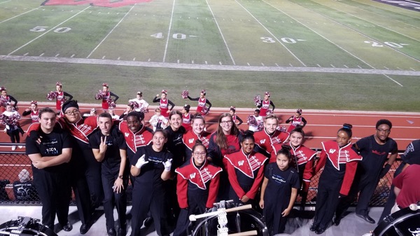 PLAYING IN THE BAND: Members of marching band keep it on a high note 