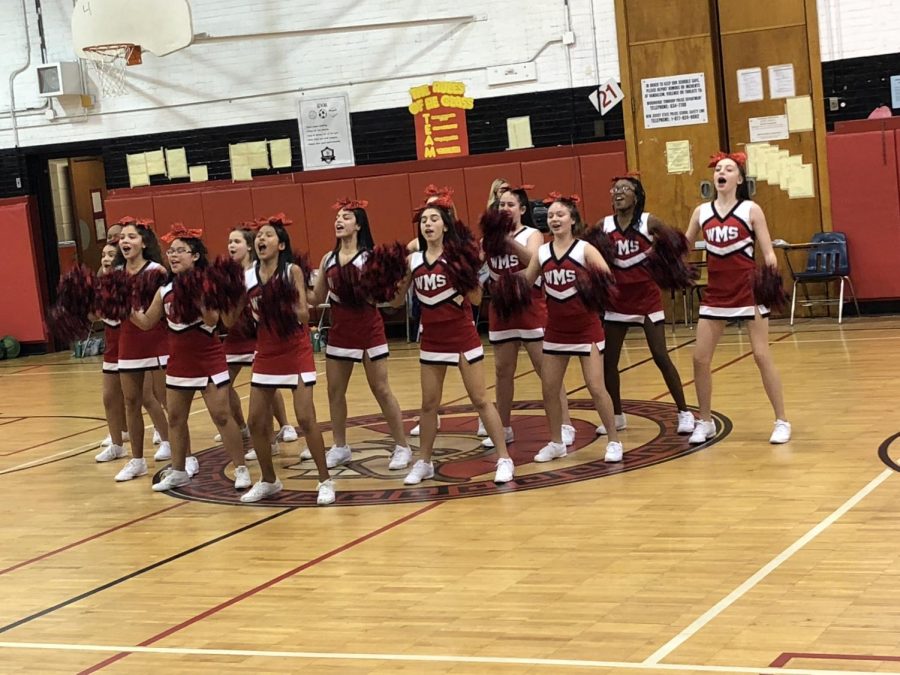 CHEERING FOR THE WIN
WMS cheerleaders cheering during half time 