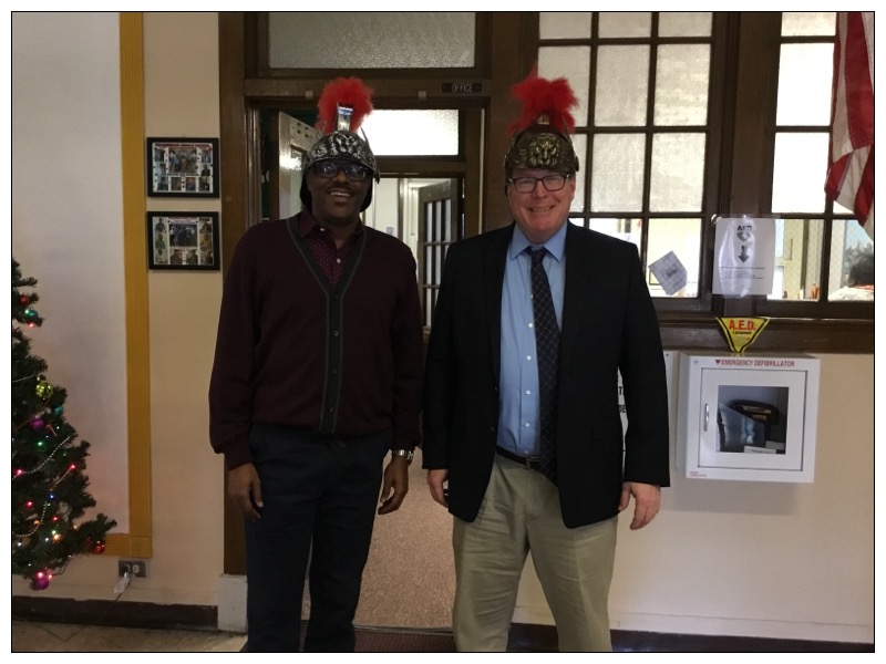 THE SCHOOL PRICIPLES ARE READY FOR SPIRIT WEEK: The the vice principle and principle are wearing the hats to represent our mascot the Warriors for spirit week.