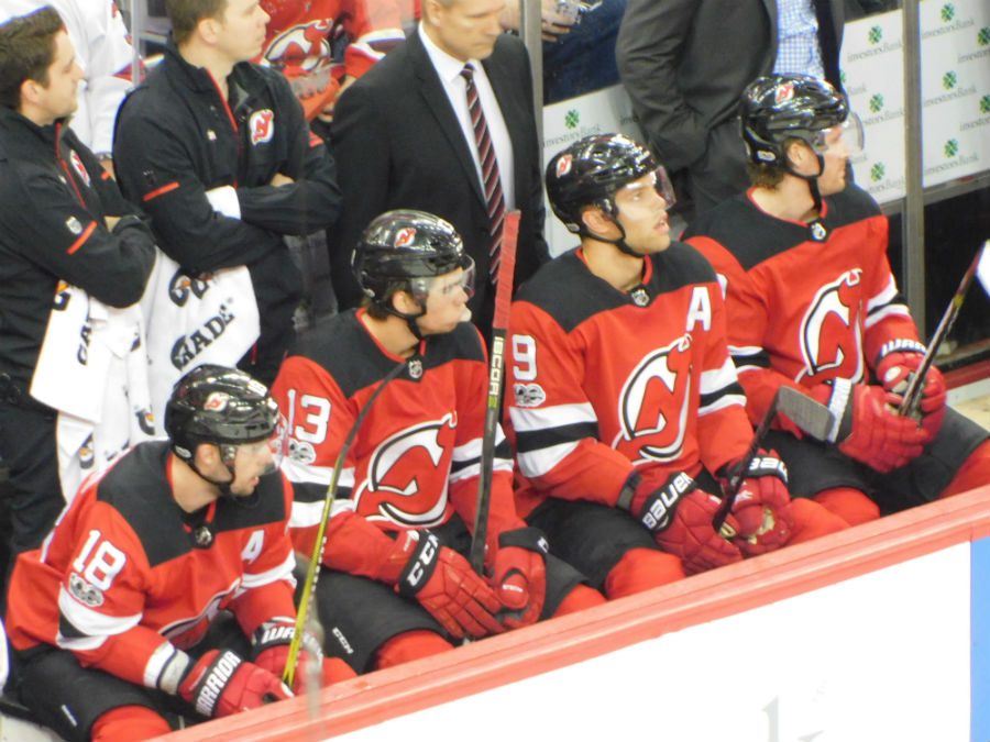 HISCHIER:Hischier is sitting on the bench with his teamates