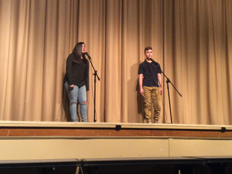 YOUR TALENT
This is a photo of two performers Ryan and Isabella singing.