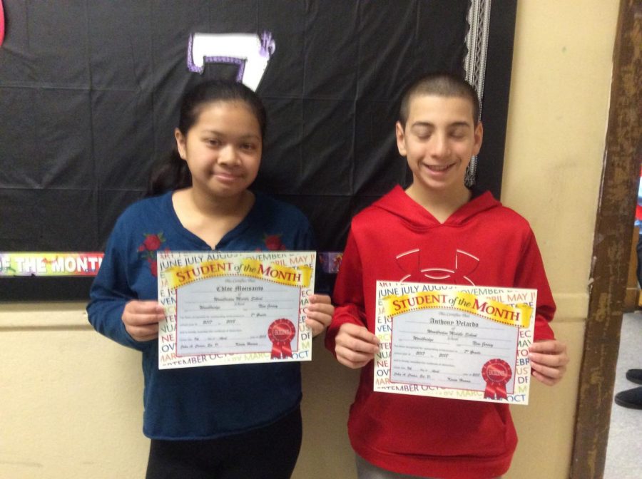 Smiling after their accomplishments ; March students of the month posing for a quick photo.