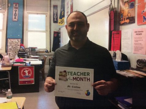 Mr.Cianfano accepting his teacher of the month award photo taken by Mrs.Torrella