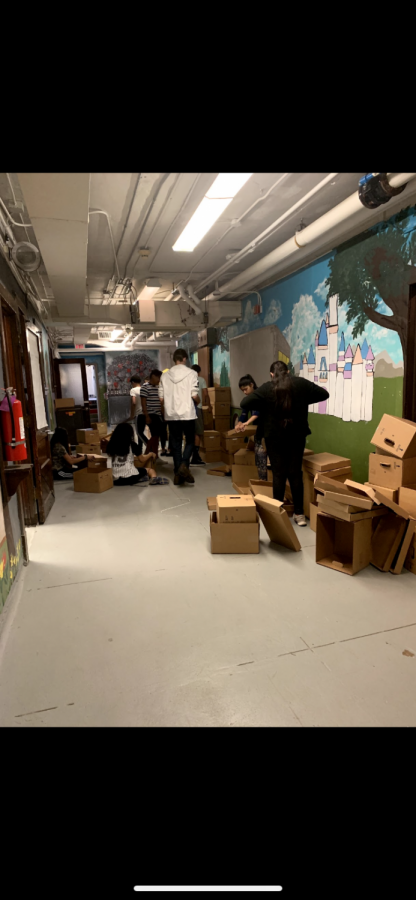 Mr.Os 8th grade stem class packing up the basement for the summer construction