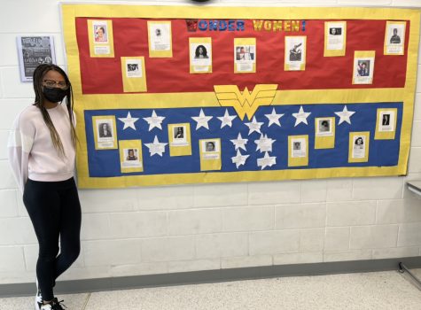 WONDER WOMEN: 7th grader, Ciara, stands proudly by WMS’s Women’s History Month poster.