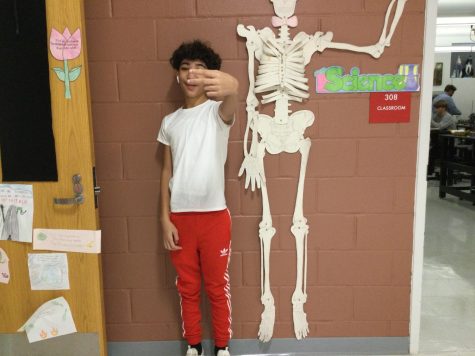 DRIPPY DELLY: Johndel outside his class with a skeleton 