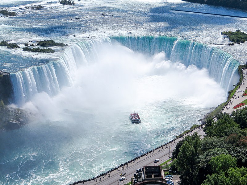 Photo via https://commons.wikimedia.org/wiki/File:Aerial_view_of_the_Canadian_Falls_%28Horseshoe_Falls%29_and_the_Hornblower_Niagara_Cruises_boat;_Niagara_Falls.JPG under the Creative Common License.