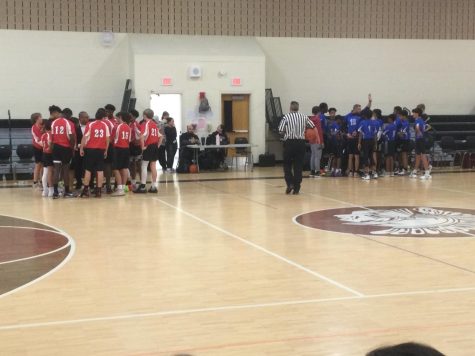 GO WARRIORS. Boys basketball talking it over during a time out.