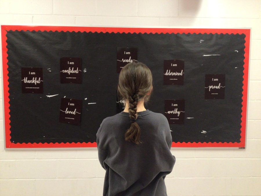 YOU ARE WORTHY - A WMS student reads the bulletin board about self-worth at WMS.