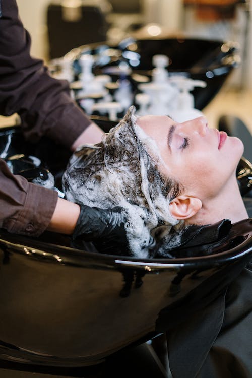 Photo via https://www.pexels.com/photo/person-washing-woman-s-hair-3993449/ under Creative Commons License. 