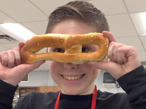 WHY KNOT BUY A PRETZEL?: 8th Grader, Jake Dinicola enjoys and toys with his salty snack at lunch.

