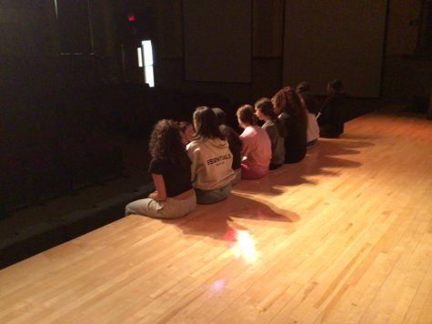 DANCE FIRST, THINK LATER: WMS dancers huddle up to discuss their dance.