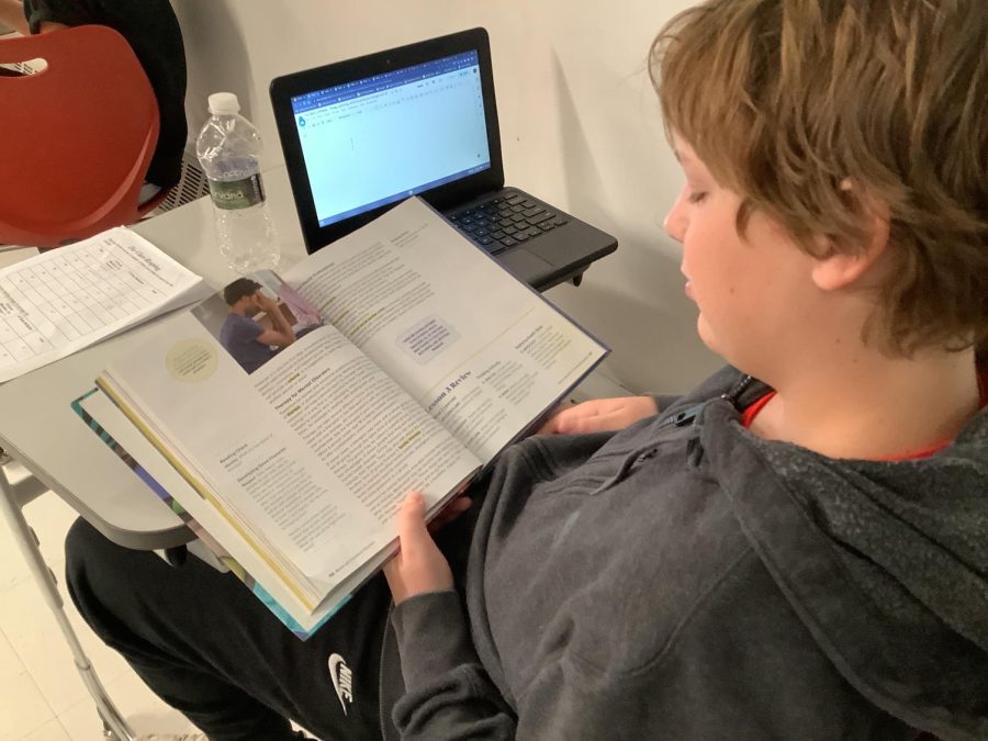 WMS LEARNING: WMS student, Thomas Oatman studies for his next health test.