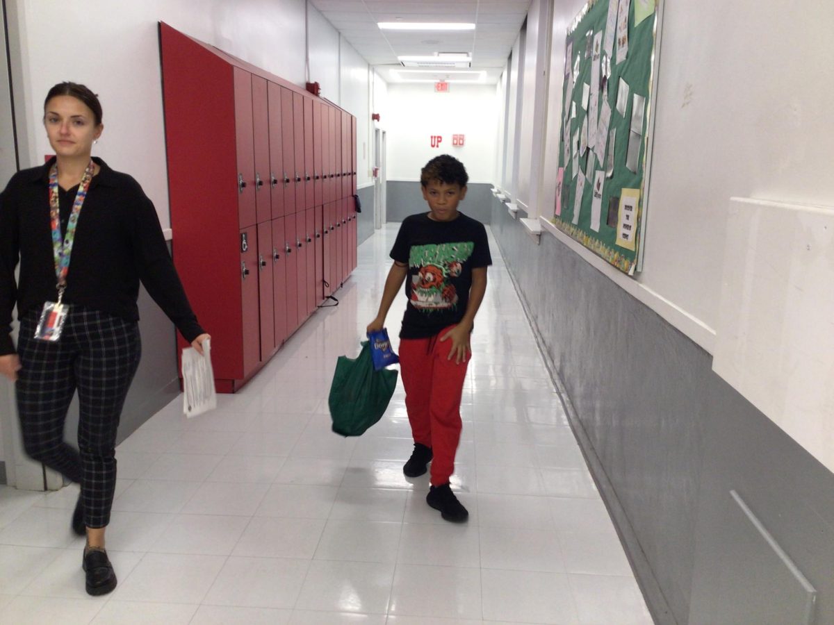 WMS student, Alex Green, walks in the hallway at the end of the day.