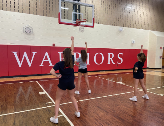 WMS students Olivia Slicner, Giuliana Traschetti, and Avery Carlson try out for the WMS cheer team.
