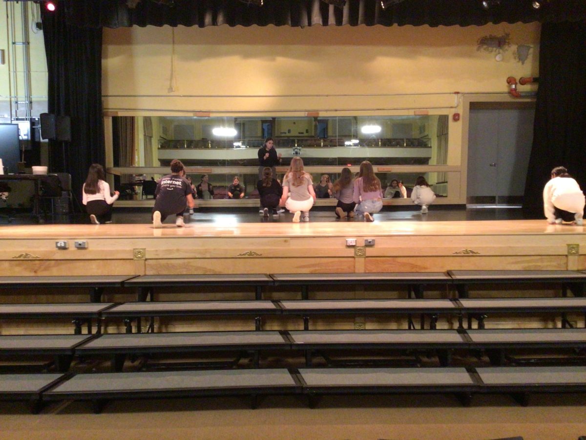 Ms.+Carelli+instructs+Dance+Company+student+in+the+WMS+auditorium.