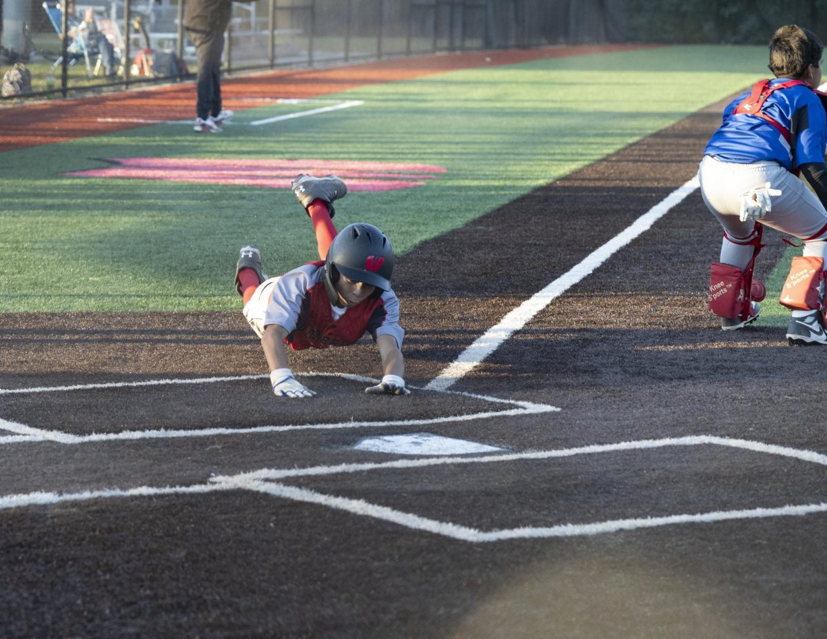 Josh Lias slides into home