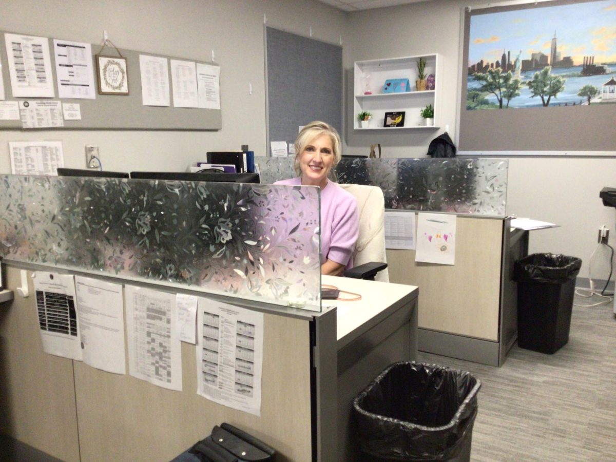 Mrs. Covino poses for a picture at the WMS main office .
