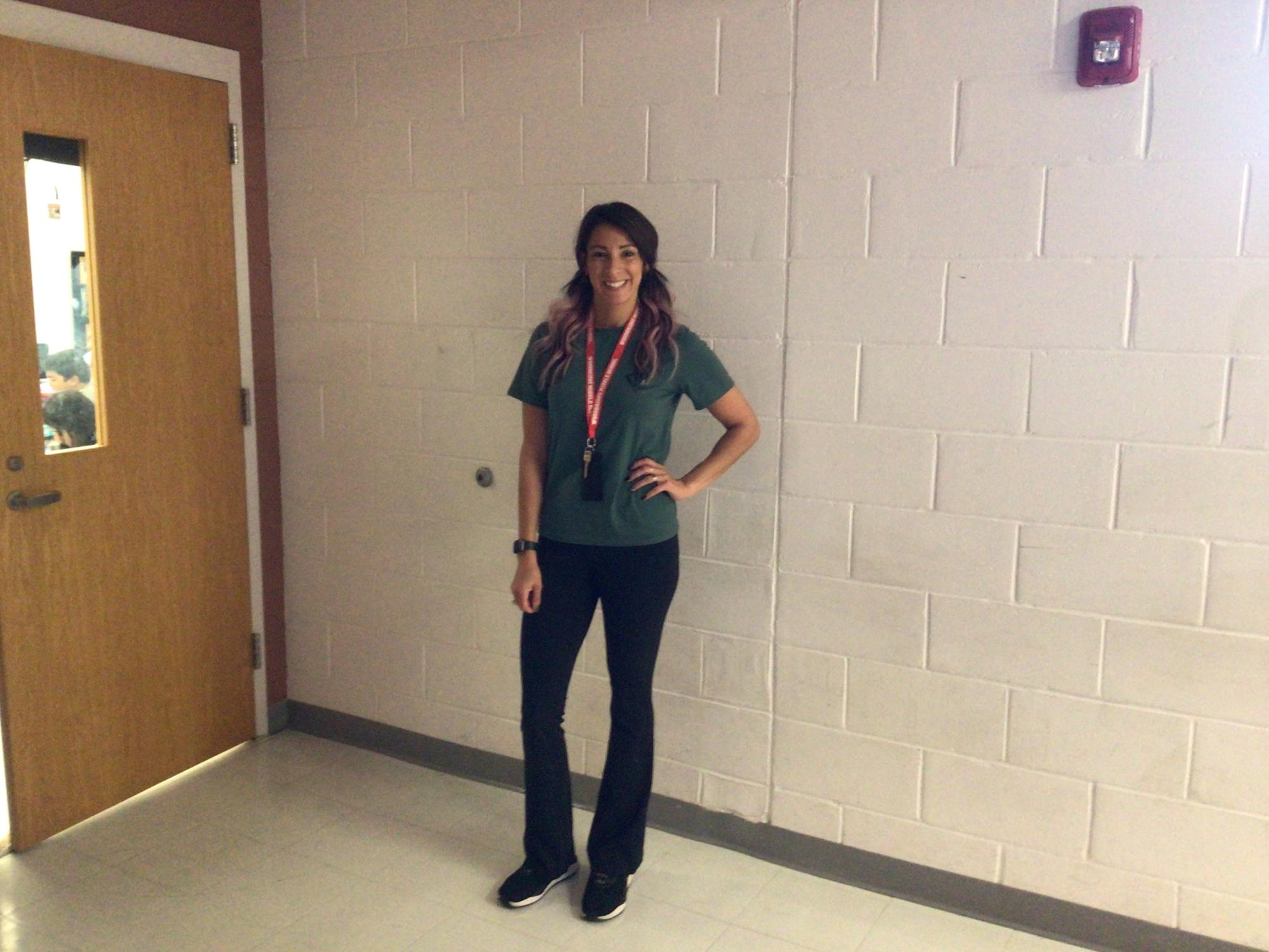 Ms. J poses for a picture at WMS.