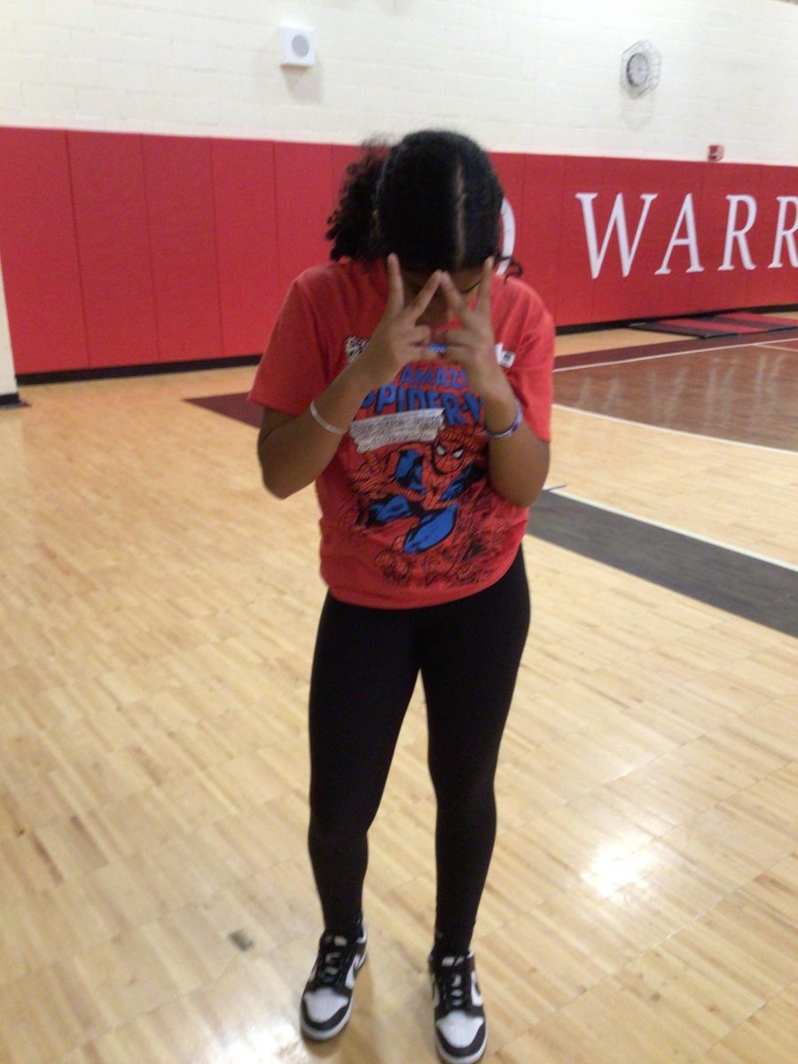 Kamia Jones poses for a picture in gym on Tuesday