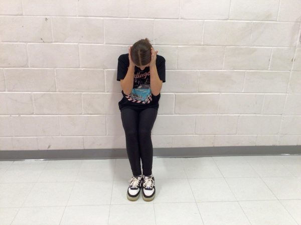 Shea Dohoney a 7th grader, poses in the hallways at WMS as a representative of anxiety.