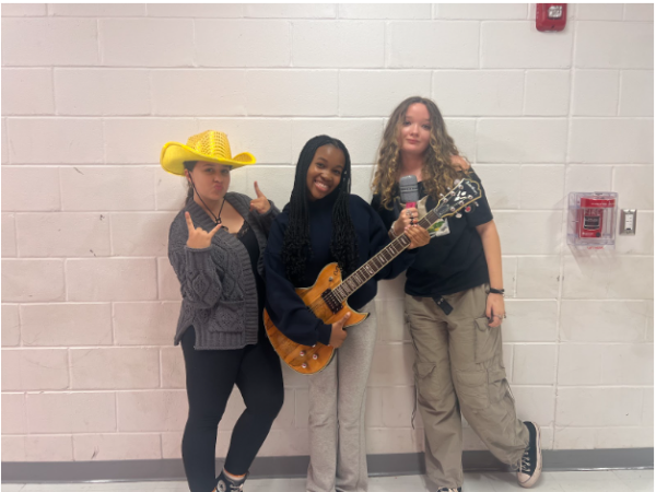 Natalie, Mia and Destiny pose for a rock and roll picture at WMS 