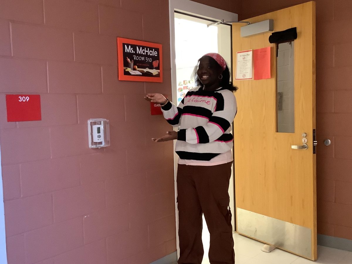 Maitee Benjamin stands outside of Ms.McHales room. 