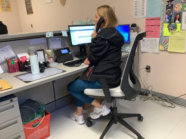 Nurse Tulli works at her office.