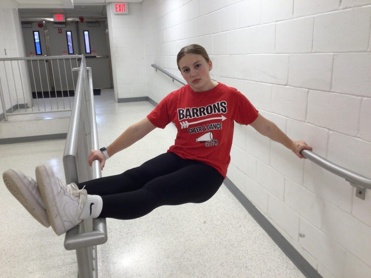 8th grader Kaylee Rapach does an interesting pose in a WMS hallway. -March 6, 2025