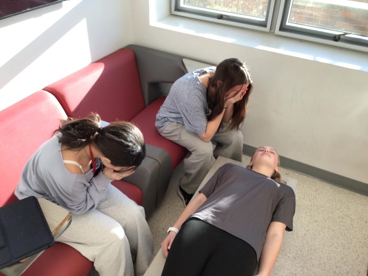 Kaylee Rapach acts dead while her friends pretend to cry in WMS on March 18, 2025.