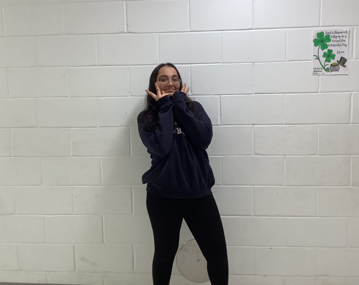 Tanisi Mistry poses for a picture outside the gym room in 4th period.
