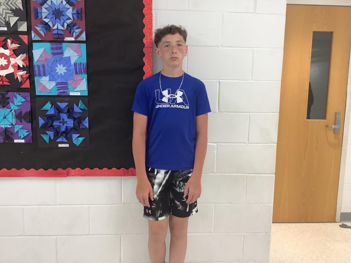 7th grader Daniel Crowley, stands by the gymnasium on Tuesday at WMS