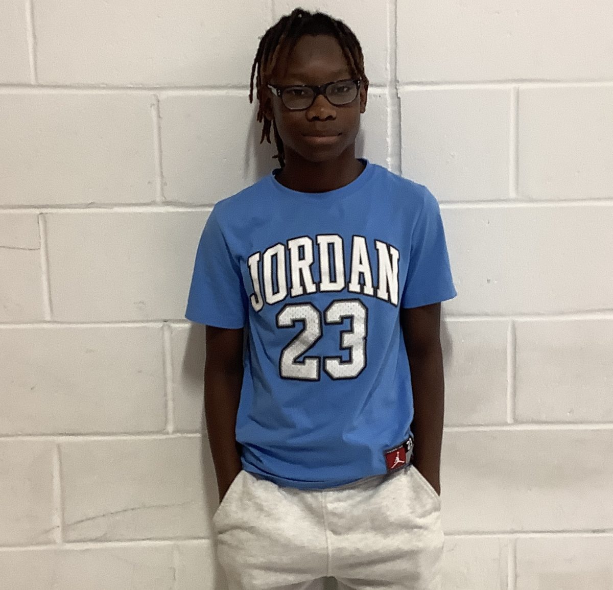 7th grader Montrell Moody poses in the hallway by Mr. Guidetti's 4th period Speaking and Presenting class on Tuesday at WMS