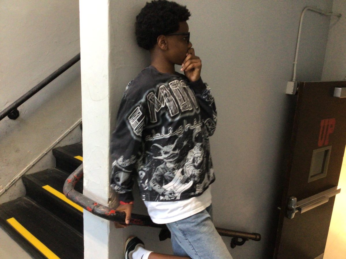 Royal Bell poses for a picture on the staircase at WMS