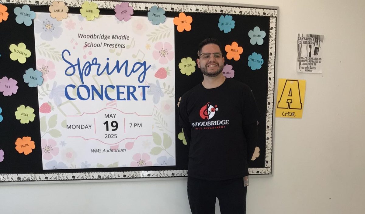 Mr. McGuire takes a picture outside of his room.