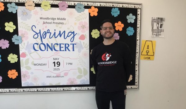 Mr. McGuire takes a picture outside of his room.