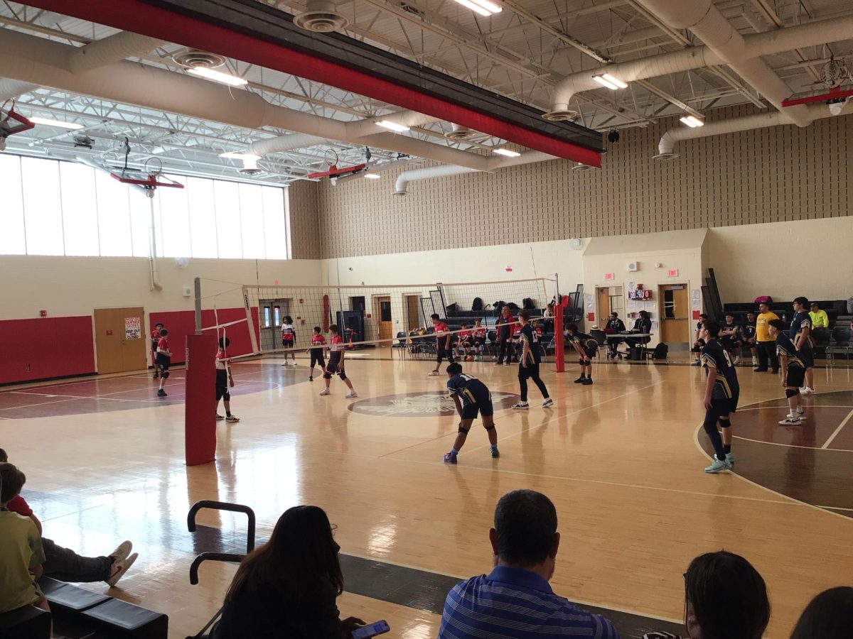 WMS Boys Volleyball team in the heat of a game on April 30th