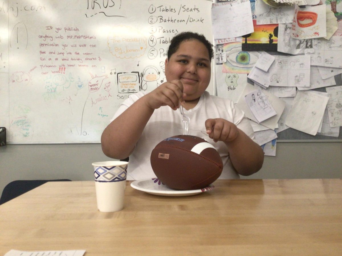 Juleus poses for a picture to be the man of the 8th grade BBQ, Get ready for the BBQ coming next week!