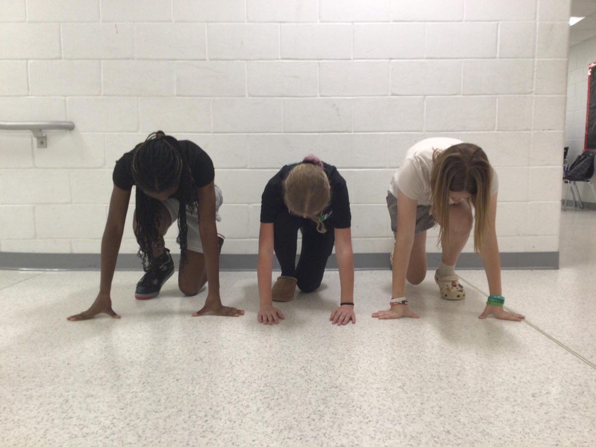 Hannah Amusa, Allison Zuber, and Alexa Dachowicz pose for a photo outside the art room on June 4th 2025. 