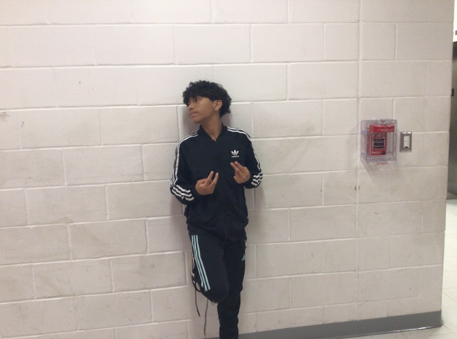Andrew poses by Mr.Olvesen's room.