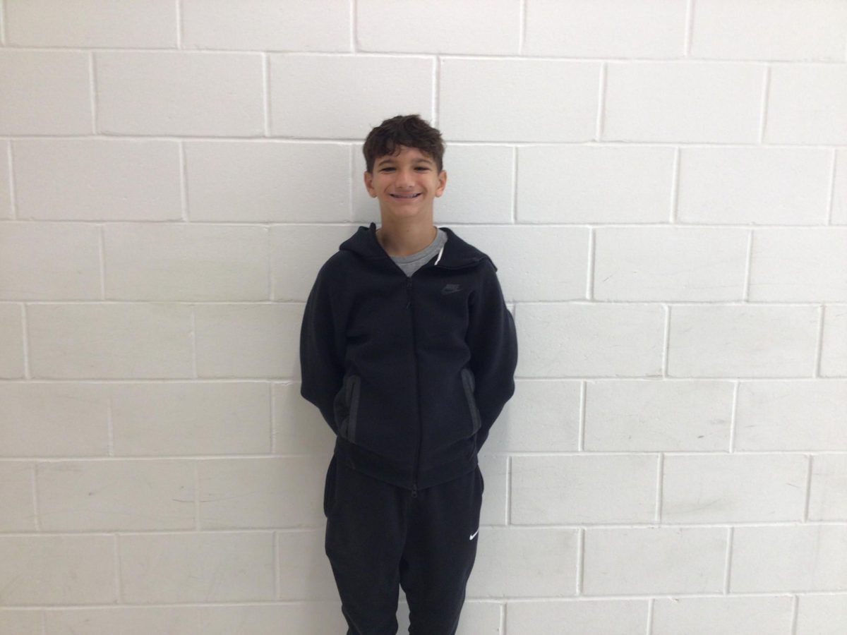 Dylan Dwyer posing in the hall by the band room on Thursday the 18th