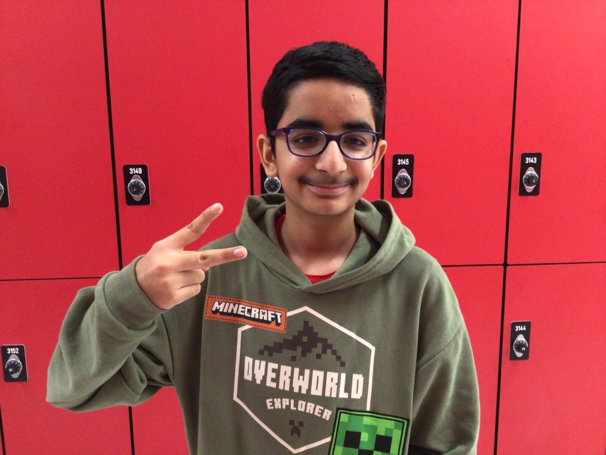Rohan Mehandirata posing in front of the lockers by Mr. Millers classroom on Friday the 19th
