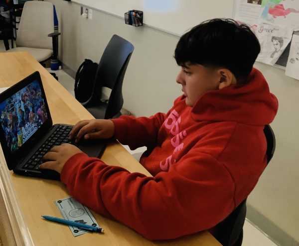 A student focuses on playing Super Smash Bros