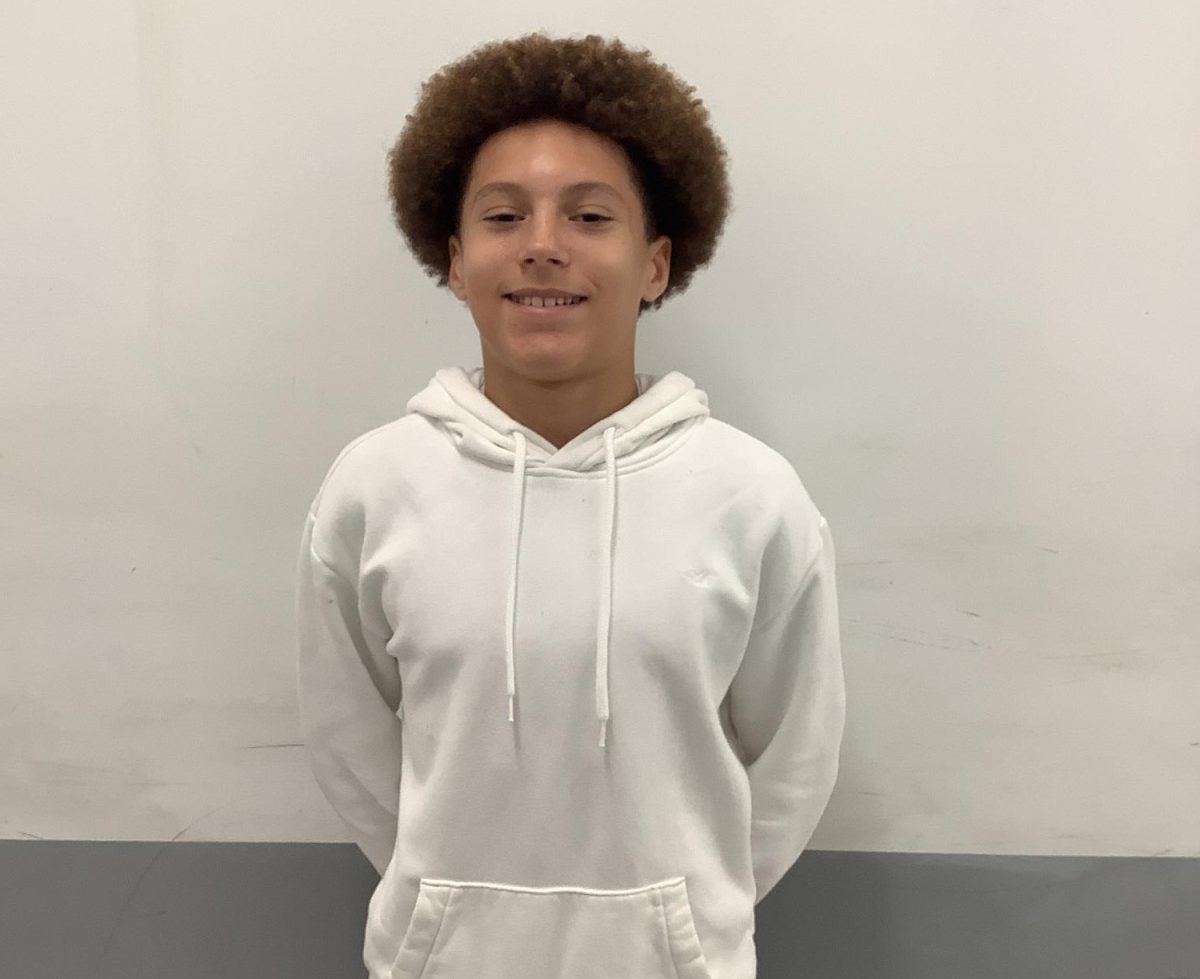 8th Grader, member of Peer Leaders, poses at WMS