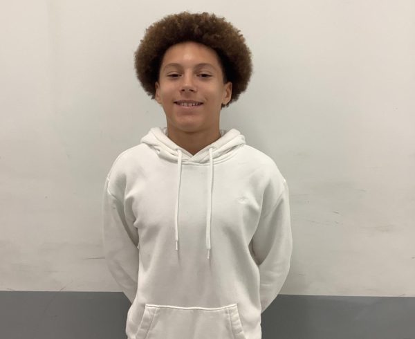 8th Grader, member of Peer Leaders, poses at WMS