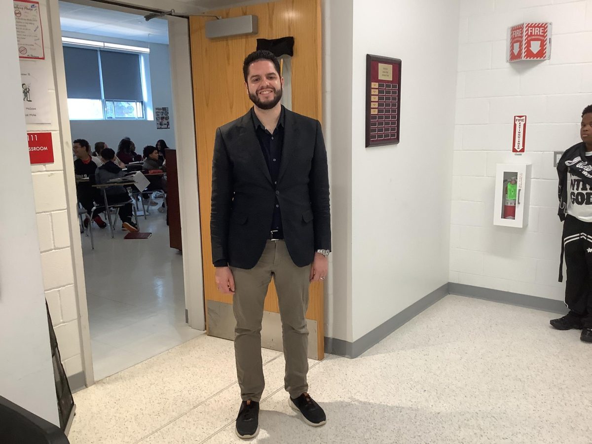 Mr. McGuire, the Vocal Music teacher, poses for a picture at WMS.
