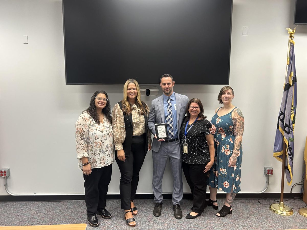 Mrs. Acheson and her associates pose for the Tree of Hope award